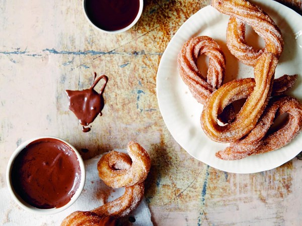 Fried choux pastry with chocolate sauce (Churros)