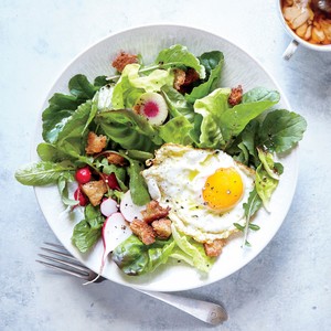 Fried egg and crunchy breadcrumb breakfast salad