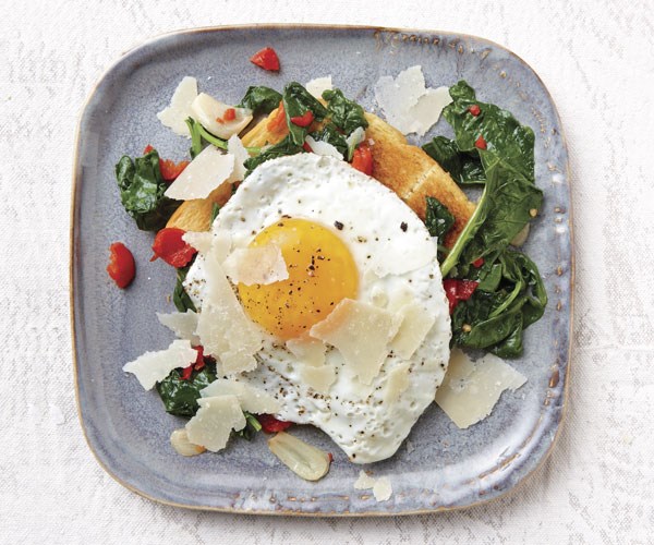 Fried egg on toast with kale and pickled peppers