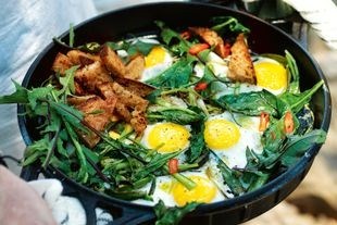 Fried eggs, greens, garlic and chilli