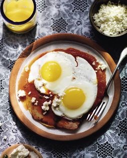 Fried eggs over crispy tortillas in rustic Oaxacan sauce (Huevos rancheros)