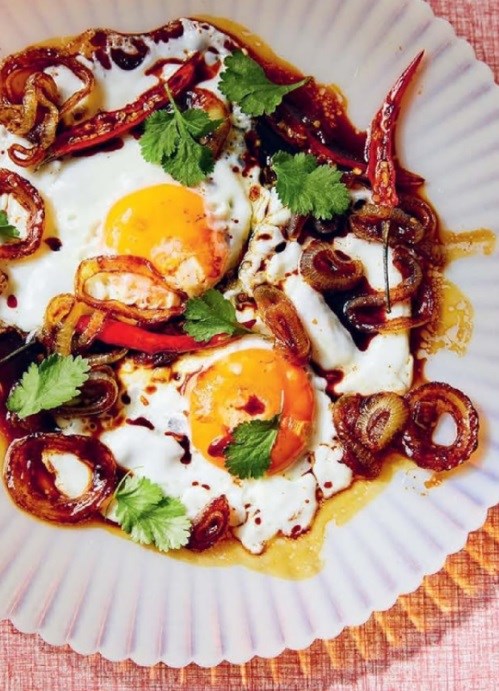 Fried eggs tempra with onions and kecap manis