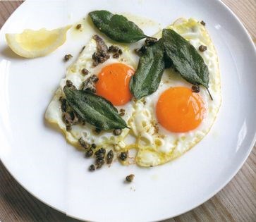 Fried eggs with capers, anchovies and sage