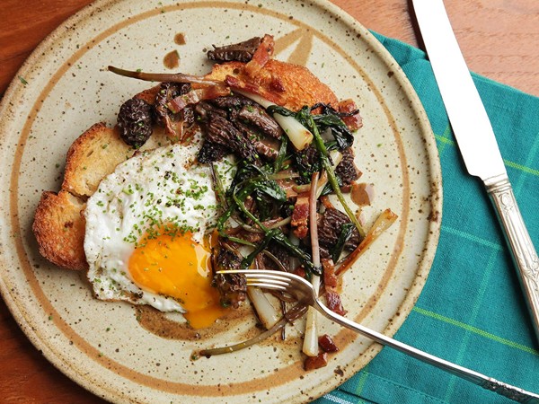 Fried eggs with ramps, morels, and bacon