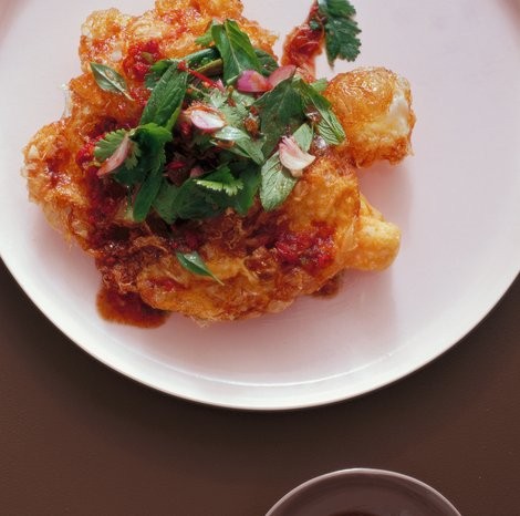 Fried eggs with spicy tamarind dressing