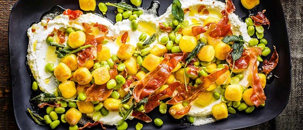 Fried gnocchi with broad beans, Parma ham, ricotta and sage