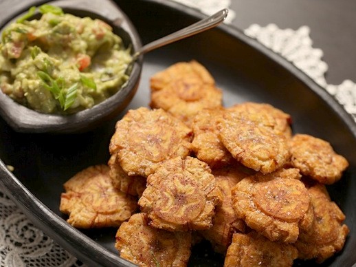 Fried green plantains (patacones) with guacamole