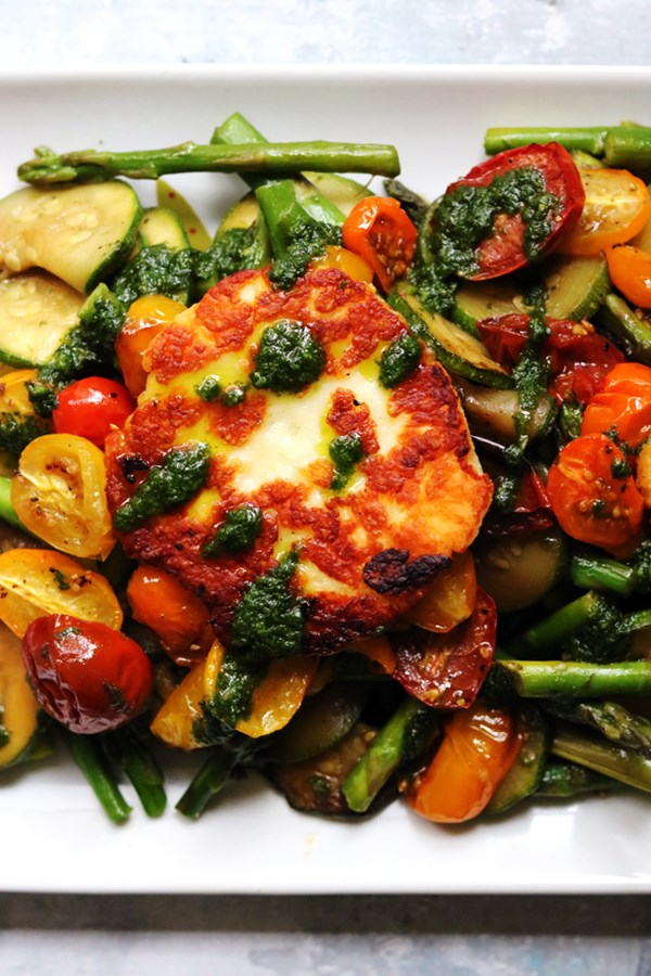 Fried halloumi, asparagus, zucchini, and roasted cherry tomatoes with basil oil