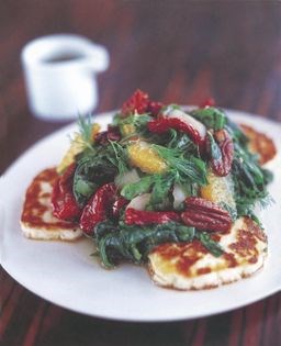 Fried haloumi topped with chilli, spinach, water chestnut, hazelnut, orange and sun-blushed tomato salad