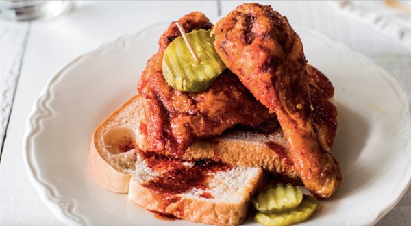 Fried hot chicken on white bread with pickles