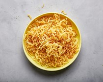 Fried onion strings with rosemary salt