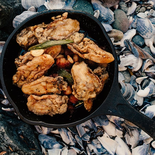 Fried oysters with bacon, garlic, and sage