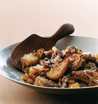 Fried potatoes with oregano and Parmesan