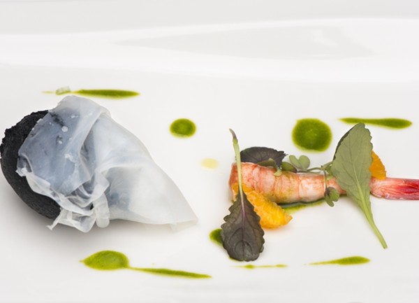 Fried puff of squid ink stuffed with burrata, raw prawn, mandarin and tarragon oil