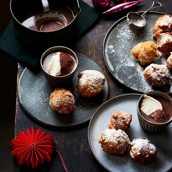 Fried puffs with hot chocolate and brandy cream