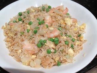 Fried rice with shrimp, ginger, onion, egg, peas and soy sauce