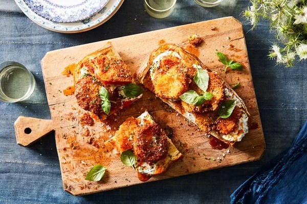 Fried tomato sandwich with lemon-basil sour cream & chile oil