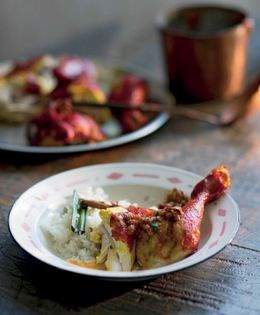 Fried whole chicken with spicy sauce