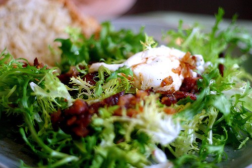 Frisee salad with lardons and poached eggs