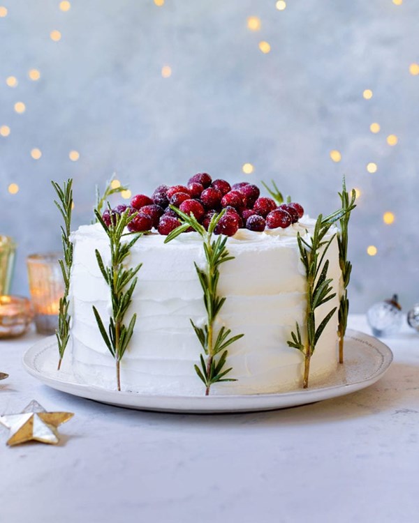 Frosted cranberry and rosemary Christmas cake