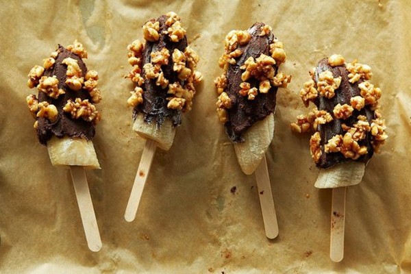 Frozen bananas dipped in Mexican chocolate ganache and spicy honeyed peanuts