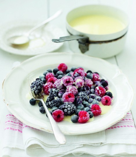 Frozen berries with hot white chocolate sauce