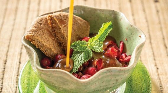 Frozen cranberries with hot caramel sauce and rye-almond spice cookies: a Finnish dessert