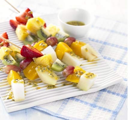 Frozen fruit sticks with passion fruit and lime drizzle