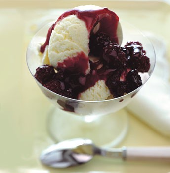 Frozen Meyer lemon cream with blackberry sauce