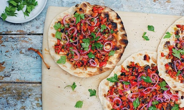 Frying pan Turkish flatbreads with spoon salad