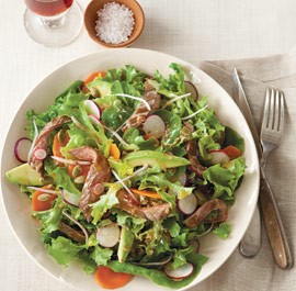 Garden lettuces with skirt steak, avocado and toasted pumpkin seeds