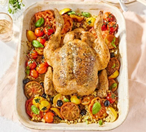 Garlic butter roast chicken with tomatoes & giant couscous