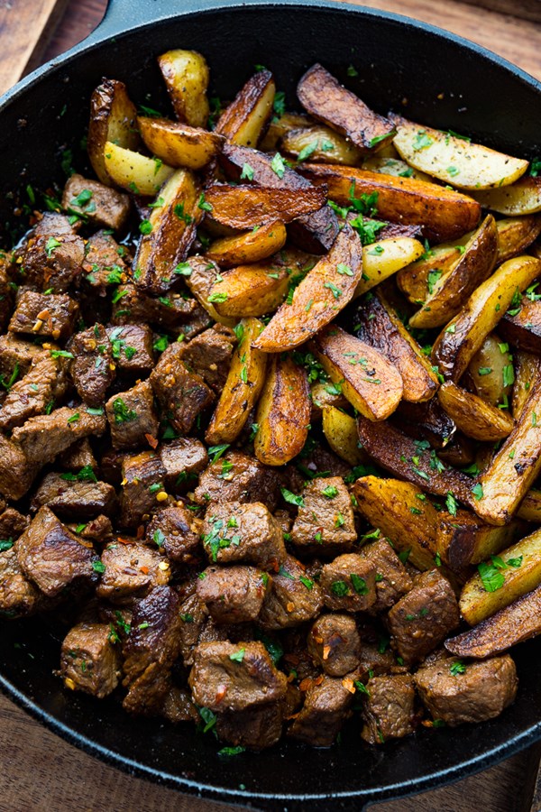 Garlic butter skillet steak bites and potatoes