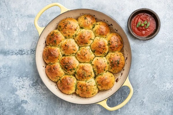 Garlic dough balls with tomato dipping sauce