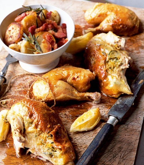 Garlic roast chicken on potatoes with rosemary and pancetta