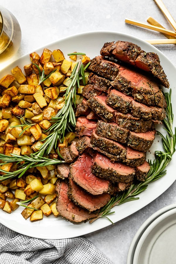 https://716f24d81edeb11608aa-99aa5ccfecf745e7cf976b37d172ce54.ssl.cf1.rackcdn.com/garlic-rosemary-beef-tenderloin-3170481l1.jpg