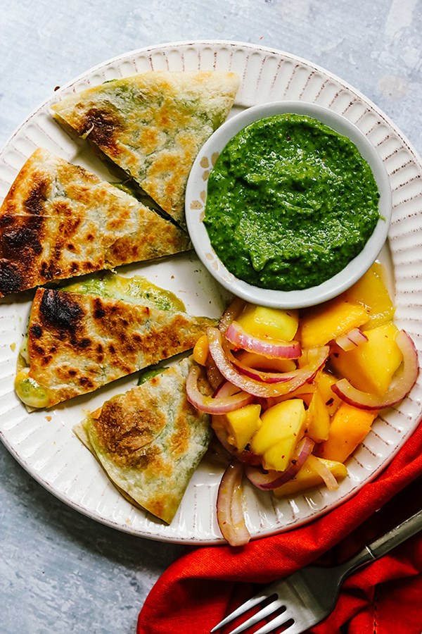 Garlic scape pesto quesadillas with spicy mango salad