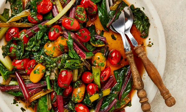 Garlicky chard with five-spice tomatoes