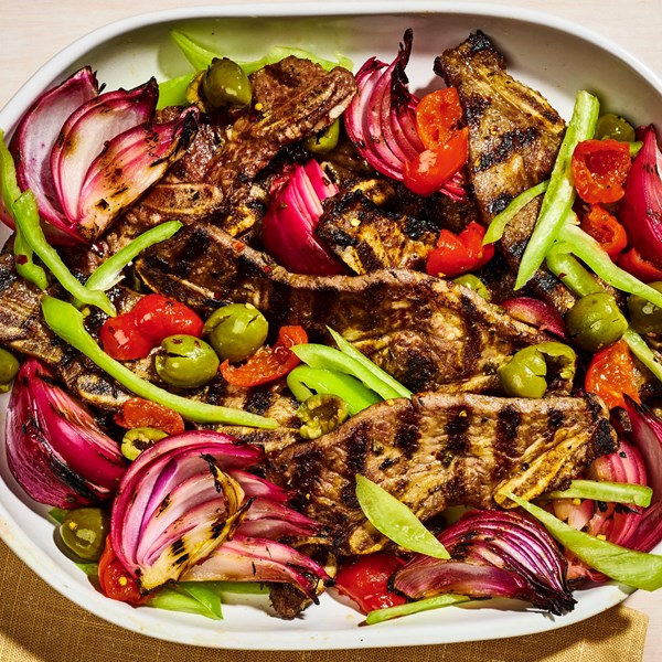 Garlicky grilled ribs with charred onion salad