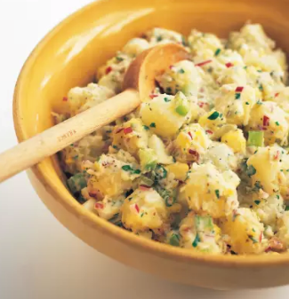 Garlicky potato salad with tomatoes and basil