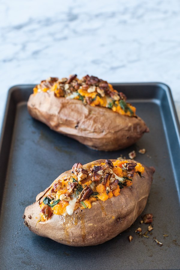 Garnet yams stuffed with greens, cheese, and pecans
