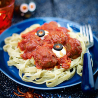 Ghoulish meatballs with wriggly snake pasta