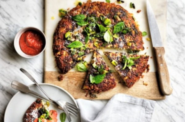 Giant couscous cake with roasted capsicum sauce