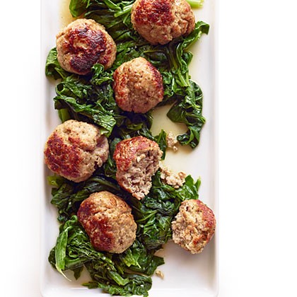Giant pork meatballs with bitter greens