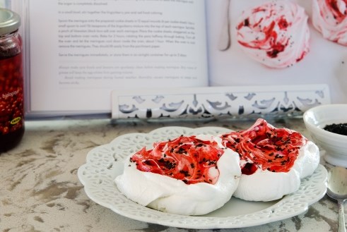 Giant red berry meringues with Hawaiian black lava salt