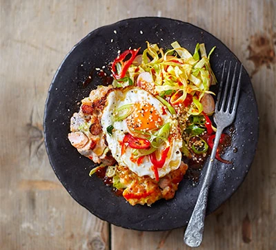 Ginger & garlic fishcakes with fried eggs & spicy slaw