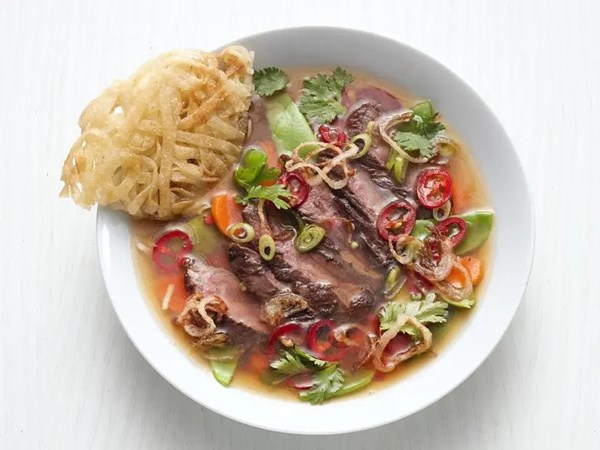 Ginger-jalapeño steak soup with fried rice noodles