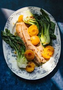 Ginger-poached apricots over salmon, choi + chili oil