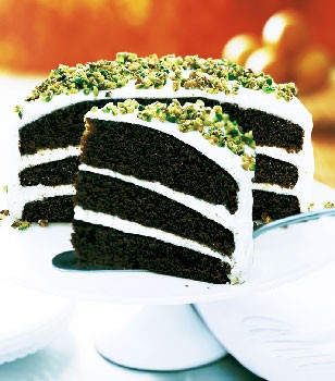 Gingerbread layer cake with cream cheese frosting and candied pistachios