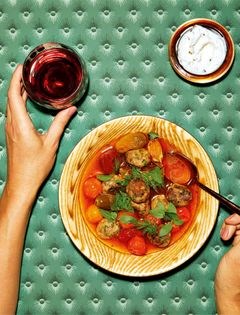 Gingery lamb meatballs with tomato confit broth and seeded yogurt